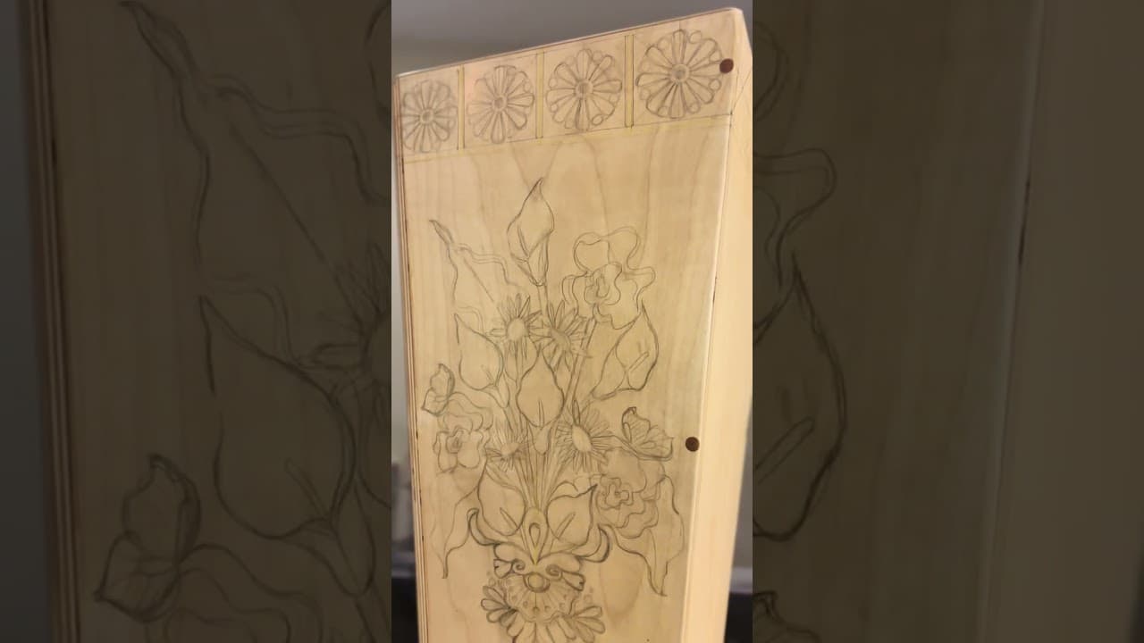 Victoria Rosas laying out design for cajón artwork.