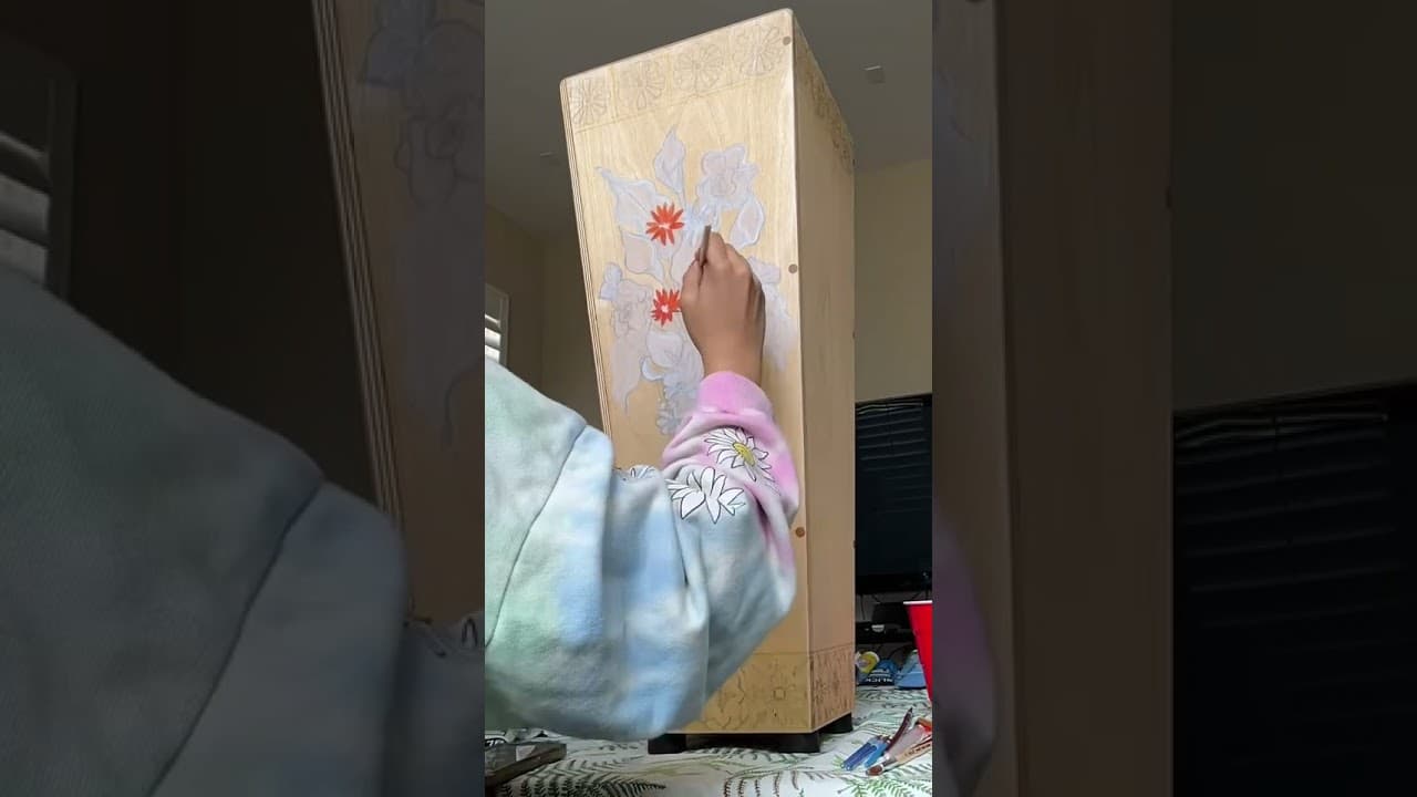 Victoria Rosas working on art for cajón